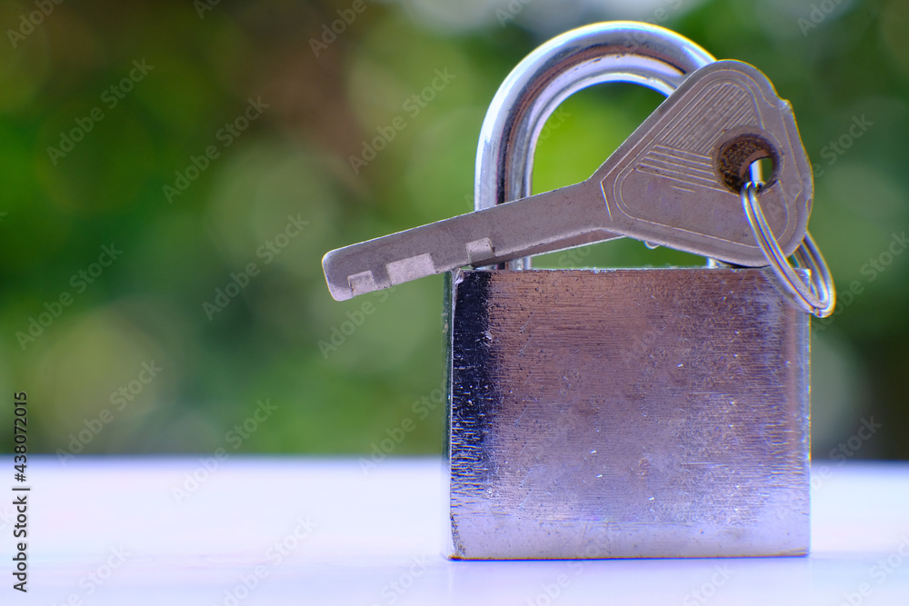 Aufkleber padlock on green bokeh background and business security concept, protecting data personal informatio