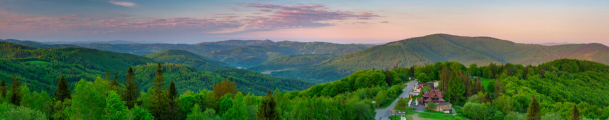 Naklejka premium Panorama of the Silesian Beskids from Rownica peak at sunrise. Poland