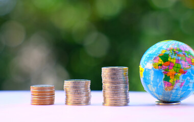 Close up coins on table background and saving money and business growth concept, Finance and investment concept, Money coin stack growing graph, advertising coins of finance and banking