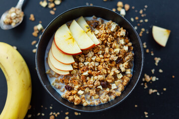 Homemade granola in bowl on dark