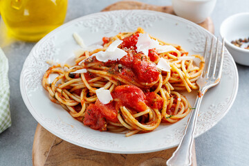 Tomato pasta with cheese on plate