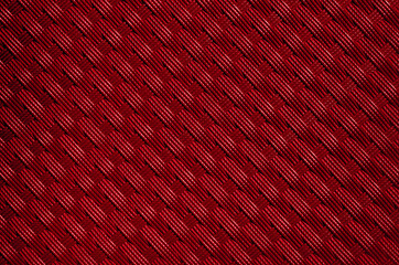 Red plastic weave for closeup textured background