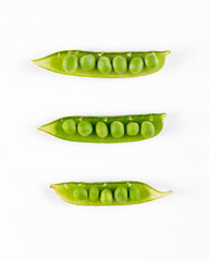 Pods with fresh green peas on white background