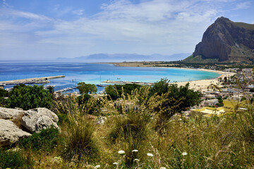 the port of San Vito lo Capo in Sicily with fishing boats on a beautiful sunny day in early summer