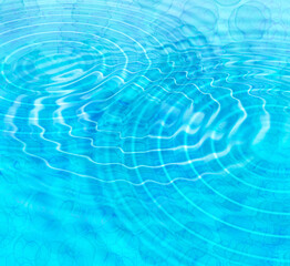 Blue abstract background with water ripples and bubbles