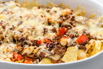 nachos with minced beef , red pepper and beans