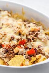 nachos with minced beef , red pepper and beans