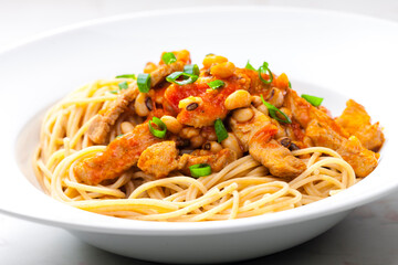 spaghetti with poultry meat, tomato sauce and beans