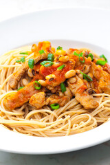 spaghetti with poultry meat, tomato sauce and beans
