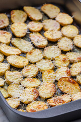 slices of potatoes baked with grated cheese