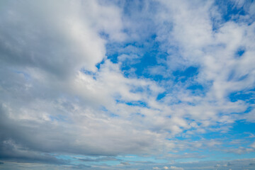 Obraz premium White clouds in the blue sky. Atmospheric natural background.