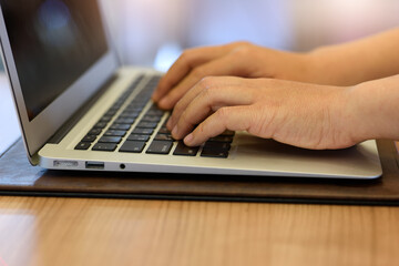 person typing on a laptop