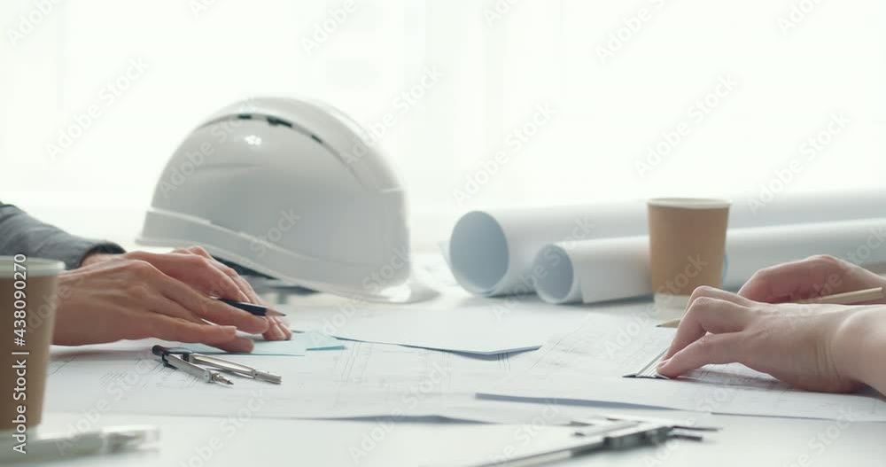 Poster architects work at a desk with sketches, drawings. construction designers create a project using blu