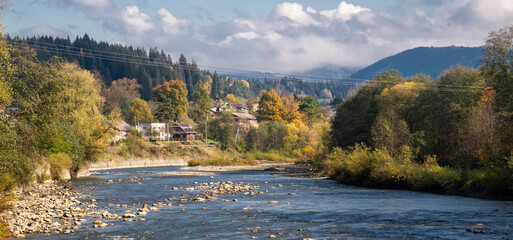 Mountain river with autumn leaves. Carpathian, Ukraine