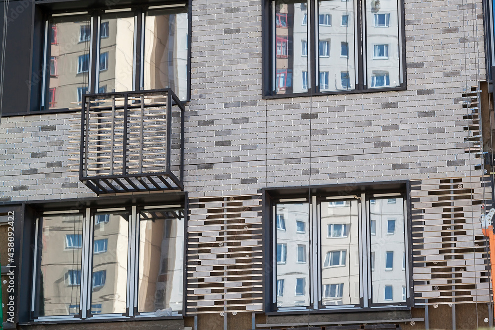 Aufkleber facade of new high-rise building with windows and compartments for external blocks of split systems.