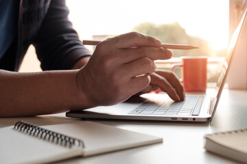 side view man using computer and ordering online
