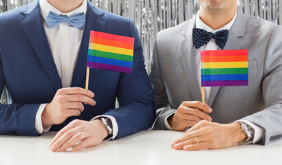homosexuality, same-sex marriage and lgbt concept - close up of happy male gay couple in suits and...