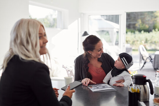 Estate agent talking to client