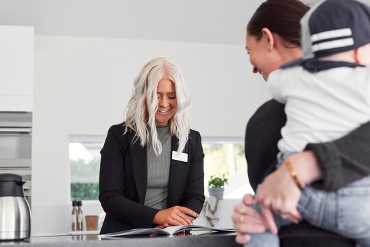 Estate agent talking to client