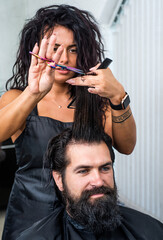mature hipster with beard and moustache care his hair in barbershop, barber