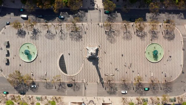 Aerial Overhead Top Down Birds Eye View Of People Walking Around Large Public Square With Water Fountains In Lisbon City Center