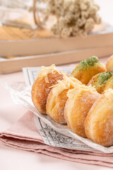 A bombolone or bomboloni is an Italian filled doughnut and is eaten as a snack food and dessert. This Bomboloni has many flavors like strawberry, chocolate, blueberry, etc.