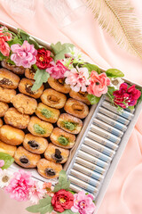 A bombolone or bomboloni is an Italian filled doughnut and is eaten as a snack food and dessert. This Bomboloni has many flavors like strawberry, chocolate, blueberry, etc.