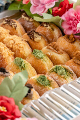 A bombolone or bomboloni is an Italian filled doughnut and is eaten as a snack food and dessert. This Bomboloni has many flavors like strawberry, chocolate, blueberry, etc.