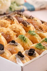 A bombolone or bomboloni is an Italian filled doughnut and is eaten as a snack food and dessert. This Bomboloni has many flavors like strawberry, chocolate, blueberry, etc.