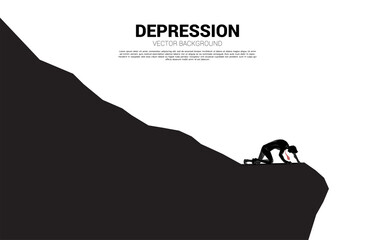 Obraz premium silhouette of businessman crawling on down hill. Concept for depression and down turn business.