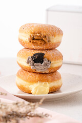 A bombolone or bomboloni is an Italian filled doughnut and is eaten as a snack food and dessert....