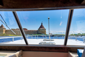 View from the cabin of a tourist boat to the old fortress