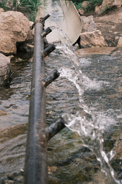 Spring water flowing out from under the hill. Spring Islam, Aktobe, Kazakhstan. The nature of Kazakhstan. Tourism in Kazakhstan.