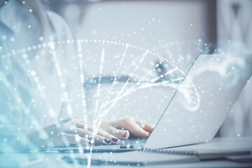 Double exposure of woman hands typing on computer and DNA hologram drawing. Medical education concept.
