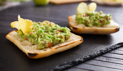 morning toast with melted cheese and guacamol