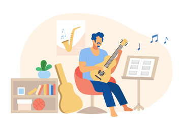 Man playing guitar at home