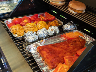 grilled meat and fish with vegetables