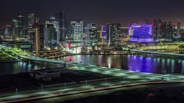 Aerial skyline of Abu Dhabi city centre from above day to night timelapse