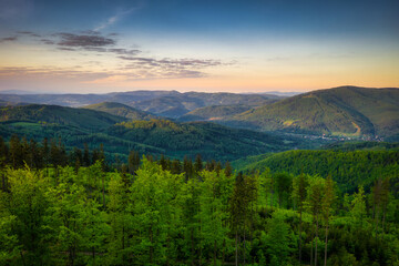 Naklejka na ściany i meble Panorama of the Silesian Beskids from Rownica peak at sunrise. Poland