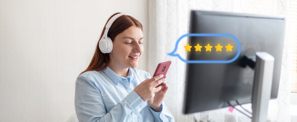 Young beautiful girl listening to music in wireless headphones. Business woman use smartphone for online shopping and typing on keyboard at home office