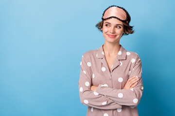 Photo of young attractive woman happy smile folded hands dream look empty space isolated over blue color background