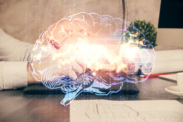 Double exposure of man's hand holding and using a digital device and brain hologram drawing. Data concept.