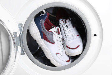 Clean sport shoes in washing machine drum