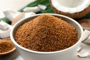 Natural coconut sugar in ceramic bowl, closeup