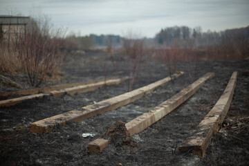 Concrete beams on the ground. Build materials after a fire.