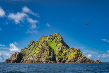 Tour boats docking to Skellig Michael island with monks hermitage on top, where Star Wars were...