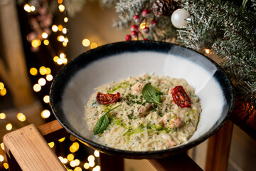 Italian risotto in new year festive surrounding, top view, side view, magazine photography