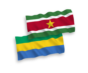 Flags of Republic of Suriname and Gabon on a white background