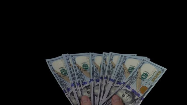 Hands Holding A Fan Of One Hundred Dollar Bills In 4K 