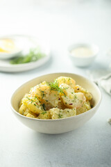 Traditional homemade potato salad with dill